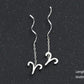 Élégantes Boucles d’Oreilles Constellation - Design Ondulé Raffiné, Sublimez Votre Style avec Une Touche Astrale